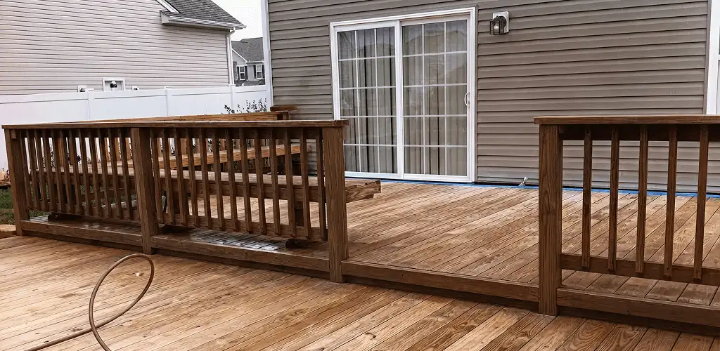 Deck sealing service protecting a backyard wood deck and railings in Tucson, AZ