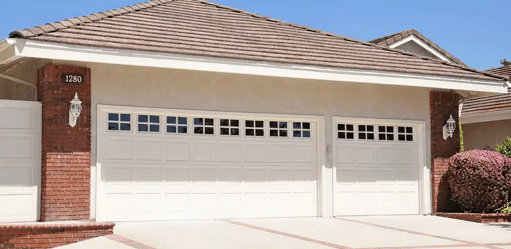 Residential garage door repair service for a double garage door in Tucson, AZ